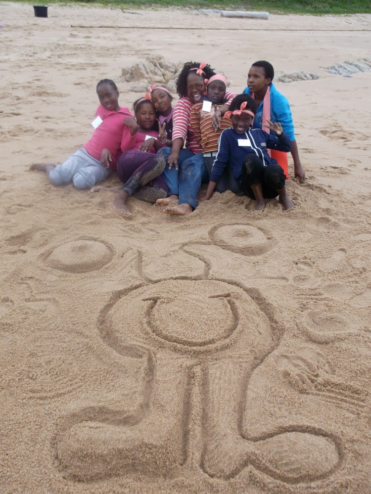 We played lots of games on the beach, including building team sand sculptures